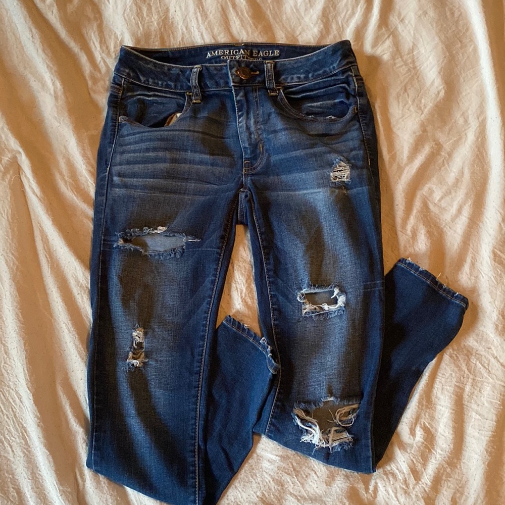 AE ripped mid waist jeggings